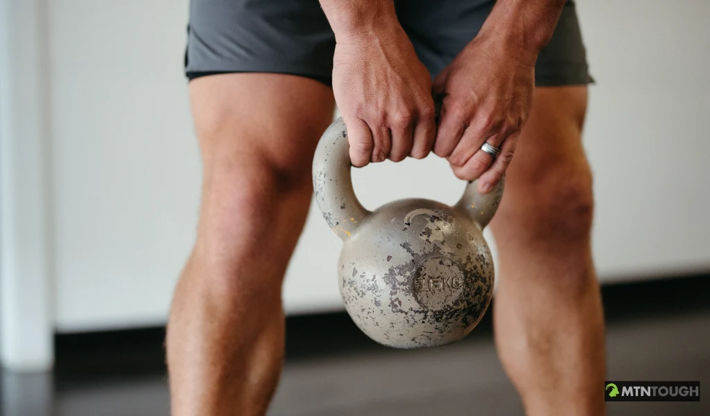 Athlete training with functional kettlebells and bodyweight conditioning